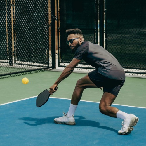 a person holding a tennis racket