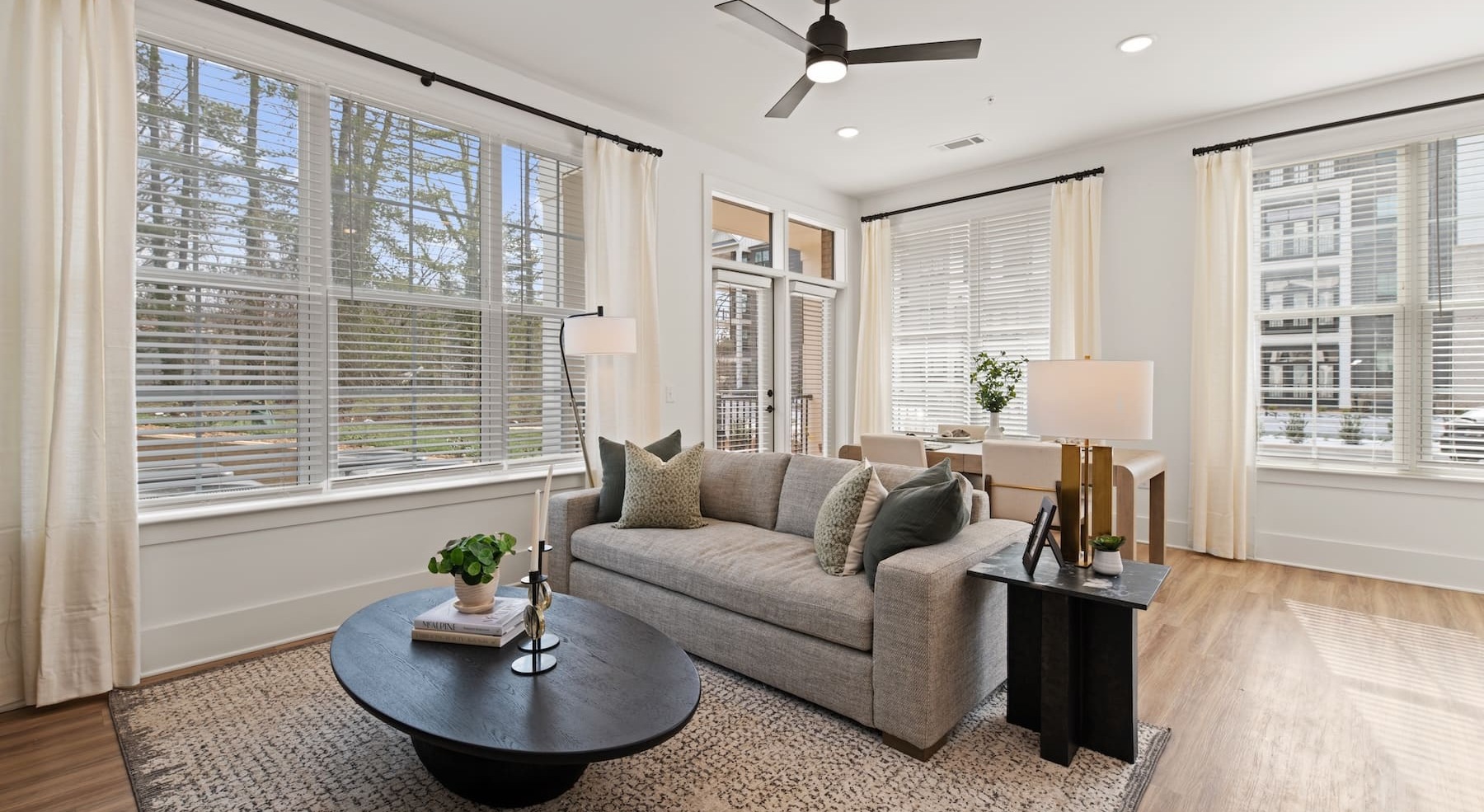 living room with a couch and large windows