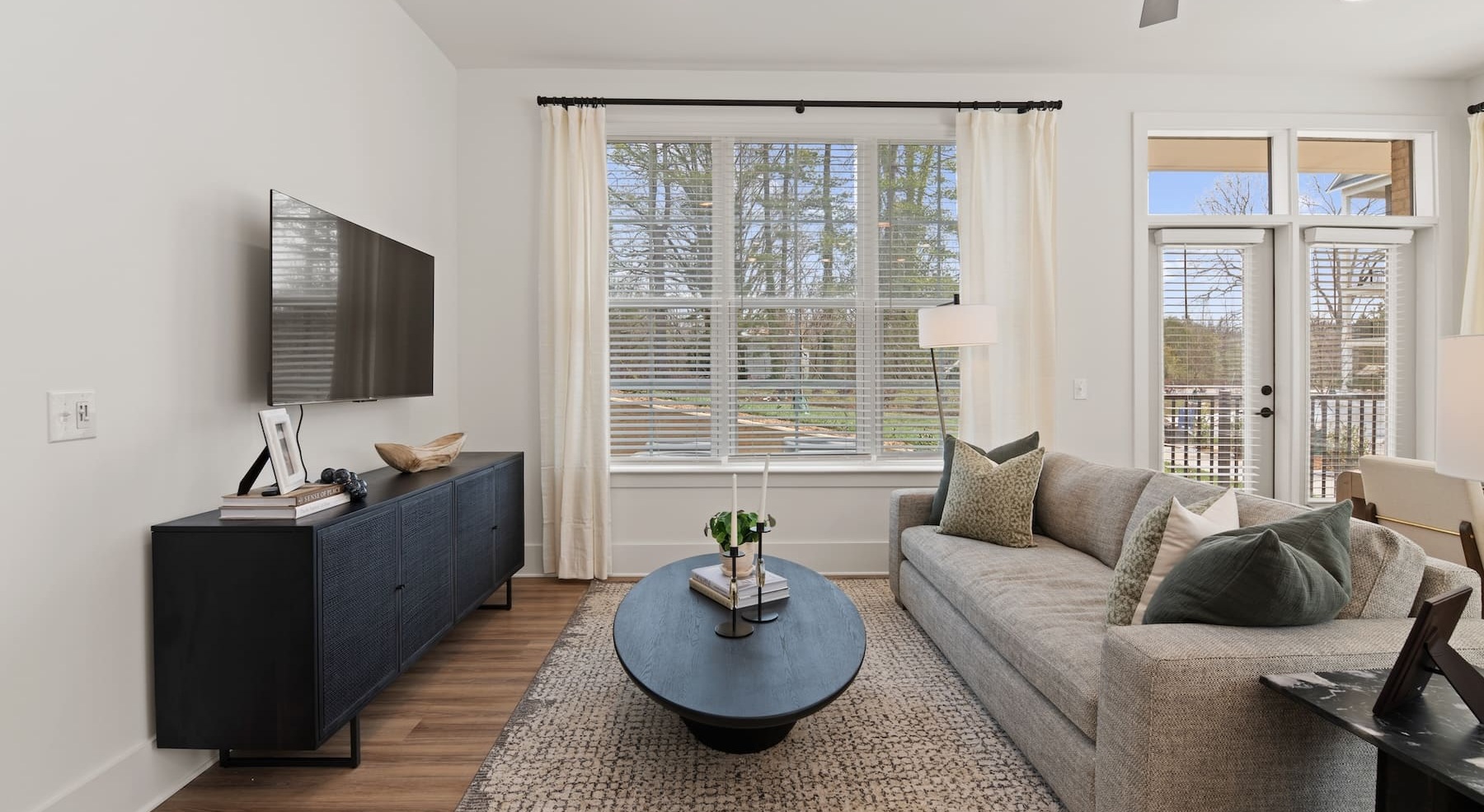 living room with a couch and large windows